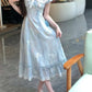 Model wearing the midi Ethereal Flower Princess Dress, showing its flowy fit and ruffled, lace-trimmed hem.