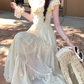 Model sitting in the Ethereal Flower Princess Heavenly Bloom Midi Dress in light yellow.