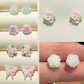 A collection of earrings in the 6-pair set from the Garden Party Pastel Earrings set.