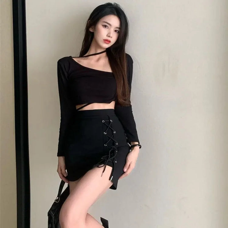 Model wearing the Laced With Attitude Mini Skort, showing the black ties and metal eyelets of the skort