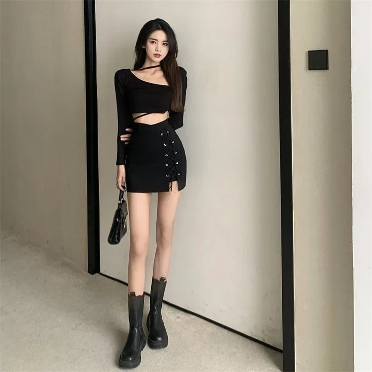 Full view of a model wearing the Laced With Attitude Mini Skort in black