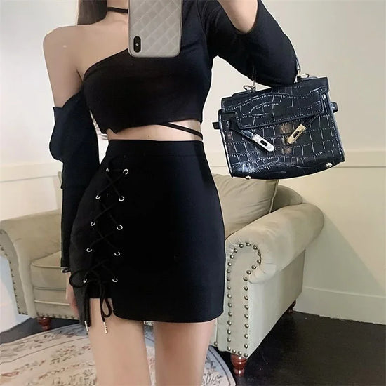 Model taking a selfie in the Laced With Attitude Mini Skort in black