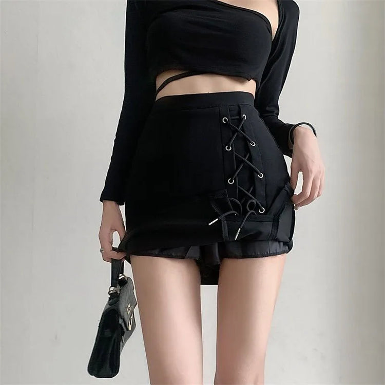 Model wearing the Laced With Attitude Mini Skort in black, displaying the shorts underneath