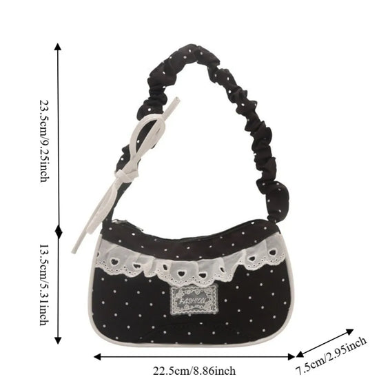 The black Lacy Dotling Purse, a polka-dot lace-trimmed purse, shown in a measurement graphic displaying its width and height.