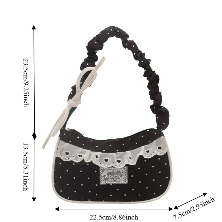 The black Lacy Dotling Purse, a polka-dot lace-trimmed purse, shown in a measurement graphic displaying its width and height.