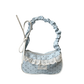 The Lacy Dotling Purse, a light blue polka-dot lace-trimmed purse, isolated by itself.