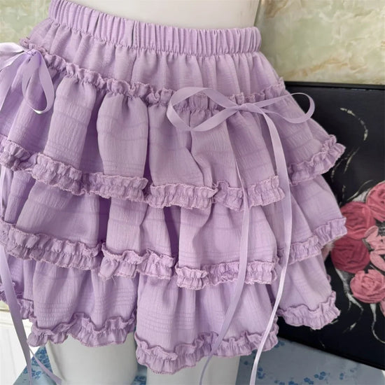 Angled view of the Lavender Lullaby Skort, displayed on a dress form with gathered waistband and ribbon details.