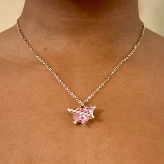 Love Orbit Necklace worn close up, showing heart pendant with orbit detai