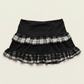 Back flat lay of the Lovestruck Skull Skort, showcasing its smooth waistband and plaid ruffle hem.