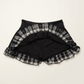 The Lovestruck Skull Skort lifted to show built-in shorts beneath the plaid ruffle layers.