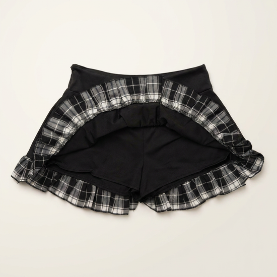 The Lovestruck Skull Skort lifted to show built-in shorts beneath the plaid ruffle layers.