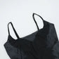 Flat lay close-up of the bust area of the Midnight Butterfly Maxi Dress, showing neckline and stitching.