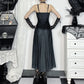 Model showing the back of the Midnight Butterfly Maxi Dress with hands on hips to reveal straps and back details.