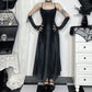 Model with hands on hips in the Midnight Butterfly Maxi Dress to display its flared fit.