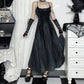 Model gently flaring out the skirt of the Midnight Butterfly Maxi Dress to display its flow and length.