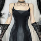 Model showing the front of the Midnight Butterfly Maxi Dress with arms extended to reveal straps and print details.