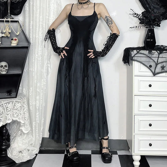 Model wearing the Midnight Butterfly Maxi Dress standing with hands on her hips, showing the full front view of the dress