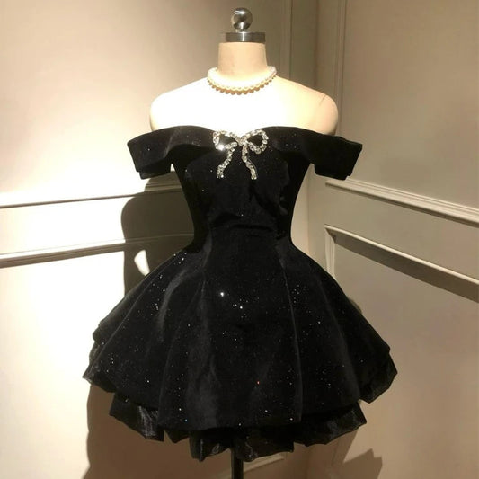 Front view of the Midnight Gala Bow Dress showing the sparkly velvet and sculpted bodice on mannequin.