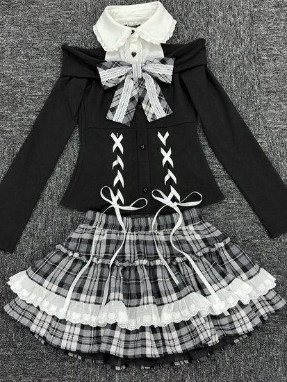 Flat lay of the complete Midnight Manor Skort Set displaying the faux two-piece sweater with corset-inspired details and the coordinating plaid skort.