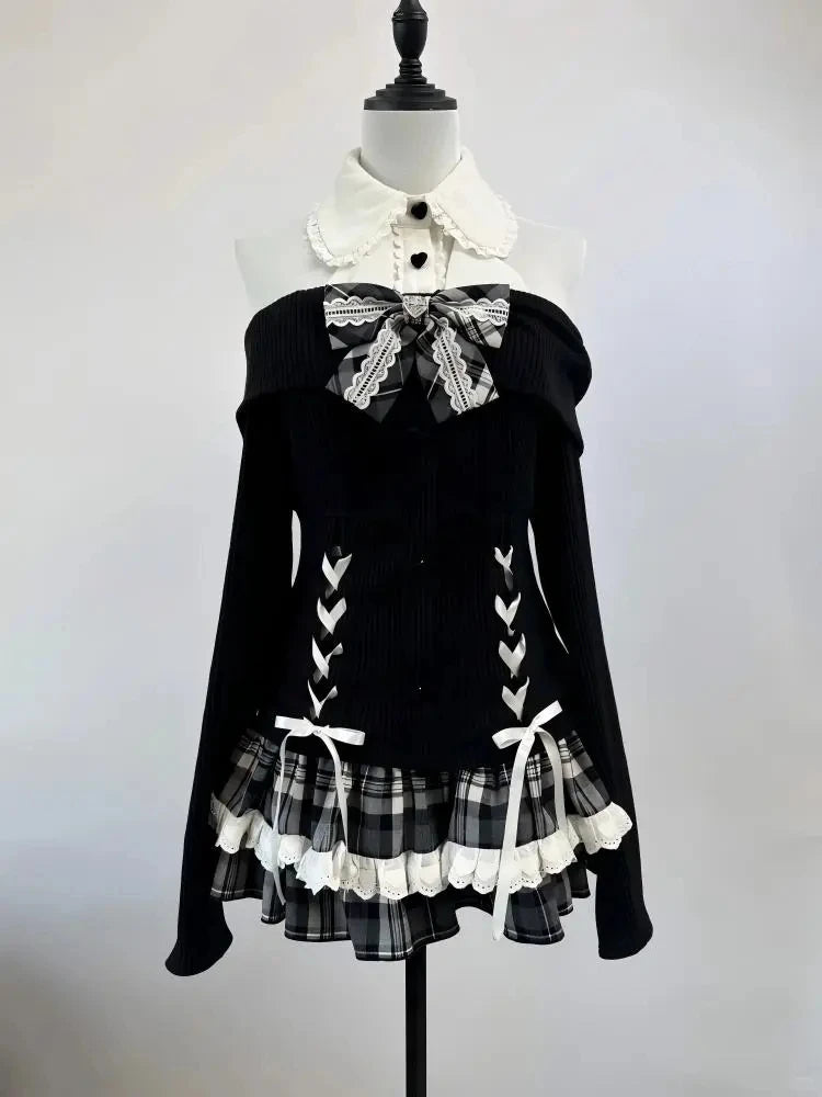 Midnight Manor Skort Set displayed on a mannequin highlighting the faux two-piece sweater and layered plaid skort.