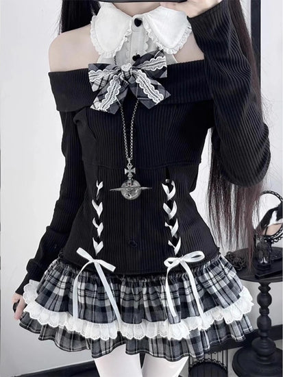 Close-up of the Midnight Manor Skort Set highlighting the faux two-piece sweater, corset-inspired lace-up front, black heart-shaped buttons, bow accents, and statement bow.