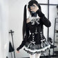Model wearing the Midnight Manor Skort Set featuring a long-sleeve sweater with a faux layered design, halter off-the-shoulder neckline, corset-inspired lace-up front, black heart-shaped buttons, statement bow, and a plaid skort with built-in shorts.