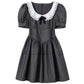 Flat lay of the Midnight Mourning Baby Doll Dress, showing seamed skirt, lace-trimmed collar, and bow
