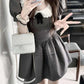 Model takes a playful peace sign selfie in the Midnight Mourning Baby Doll Dress, showing collar and puff sleeves