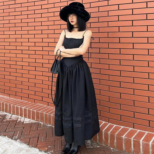 Angled view of the Midnight Sonata Corset Dress, showing the fitted bodice and maxi-length flow.
