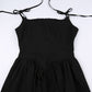 Flat lay close-up of the corset-inspired detailing and tie straps on the front of the Midnight Sonata Corset Dress.