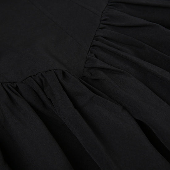 Close-up of the corset-inspired paneling on the front of the Midnight Sonata Corset Dress.