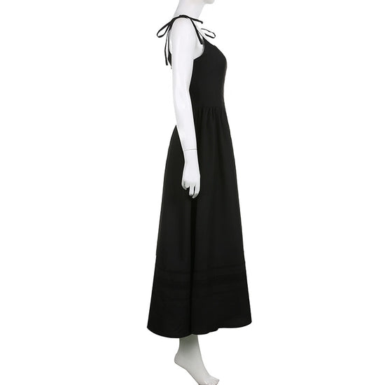 The Midnight Sonata Corset Dress on a white mannequin, showing the side of the dress, full length, and silhouette.