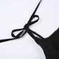 Detail of the tie shoulder straps on the Midnight Sonata Corset Dress.