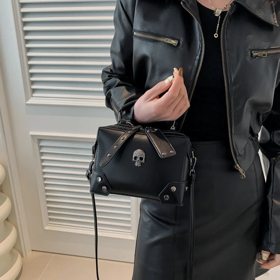 Close-up of the Moonlit Mourning Crossbody with the cross embellishment.