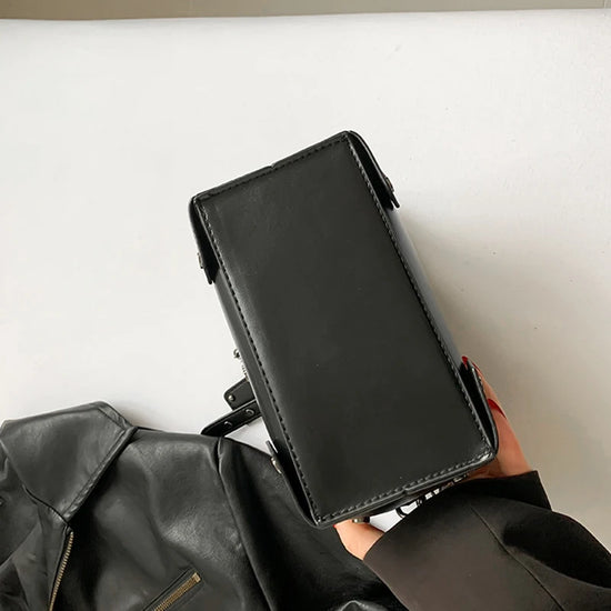Bottom of the Moonlit Mourning Crossbody showing the smooth PU leather finish.