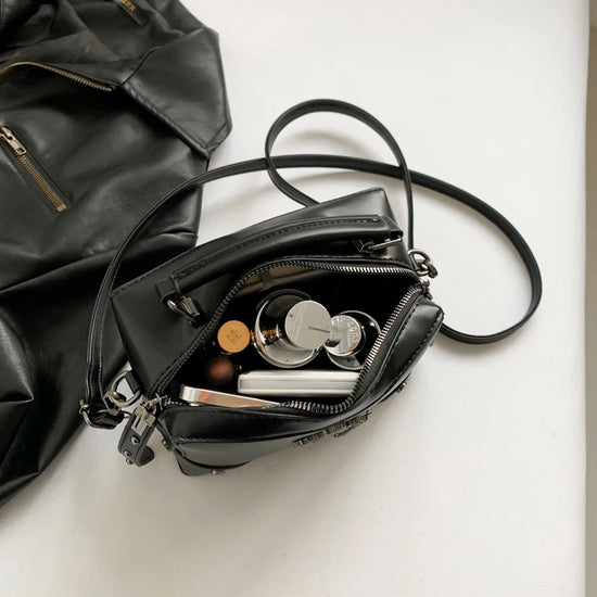 Open view of the Moonlit Mourning Crossbody showing the interior compartment.