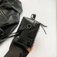 Side profile of the Moonlit Mourning Crossbody showing its slim depth.