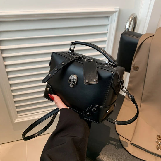 Angled handheld view of the Moonlit Mourning Crossbody featuring the skull design.