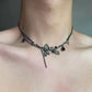 The Moonvine Dragonfly Necklace worn as a dark romantic choker with dragonfly-inspired details and smoky silver chains.