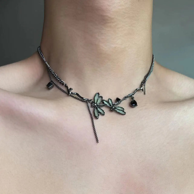 The Moonvine Dragonfly Necklace worn as a dark romantic choker with dragonfly-inspired details and smoky silver chains.