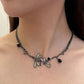 Side-angle view of the Moonvine Dragonfly Necklace featuring asymmetrical chain details and a dreamy gothic-inspired design.