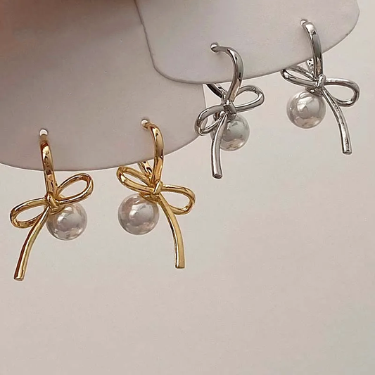 Gold and Silver Pearl Whim Bow Earrings displayed together