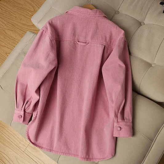 Back view of the Pink Petal Denim Overshirt, highlighting the oversized silhouette and curved hem.