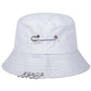The Rebel Pin Bucket Hat in white with silver safety pin details for a clean yet edgy look.