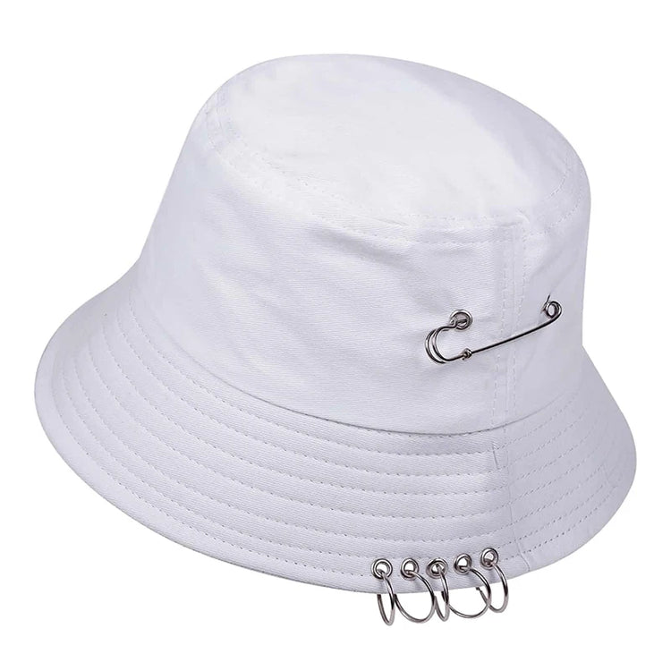 Side angle of the Rebel Pin Bucket Hat in white showcasing the minimalist design with metal pin accents.