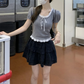 Gray Ribbon Knit Ballet Top paired with a ruffled skirt for a balletcore-inspired outfit
