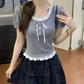 Gray Ribbon Knit Ballet Top styled with a layered black skirt, showing fitted silhouette
