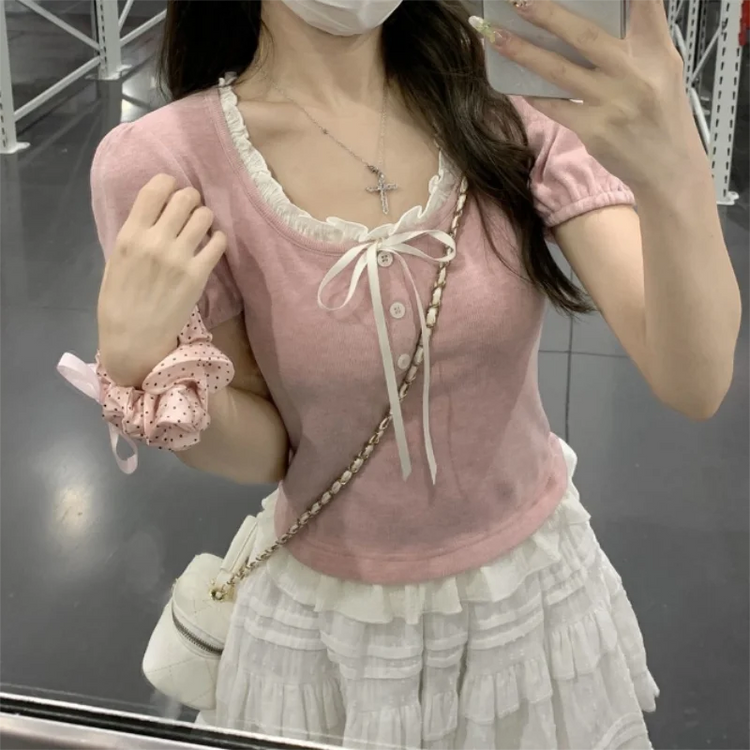 Pink Ribbon Knit Ballet Top worn fitted with short sleeves, showcasing feminine ballet-inspired design