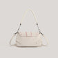 Back view of the cream Ribbon Romance Shoulder Bag, showcasing the soft velvety finish and detachable shoulder strap.