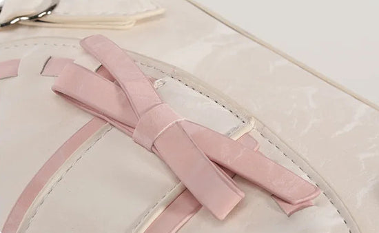 Close-up of the Ribbon Romance Shoulder Bag, highlighting the statement ribbon bow and interwoven ribbon detailing.